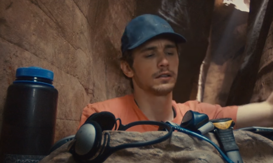 image of Aron Ralston looking at his stuff