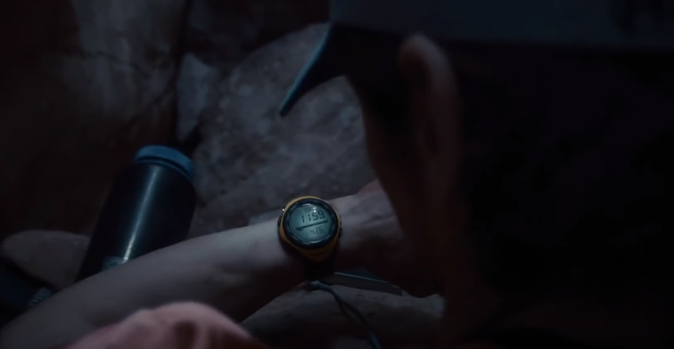 image of Aron Ralston looking at his watch