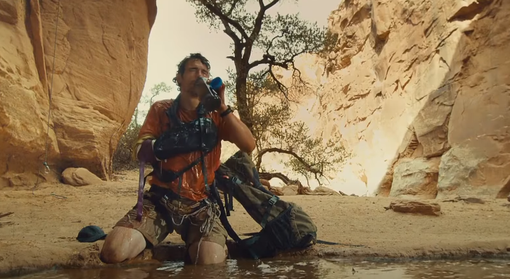 injured man drinking water