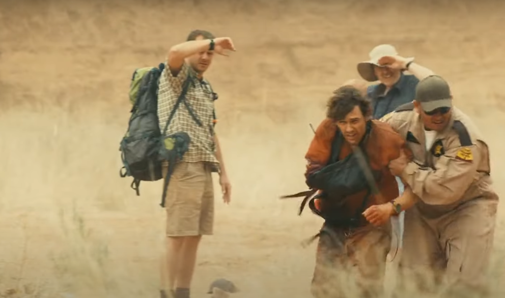 image of Aron Ralston getting help