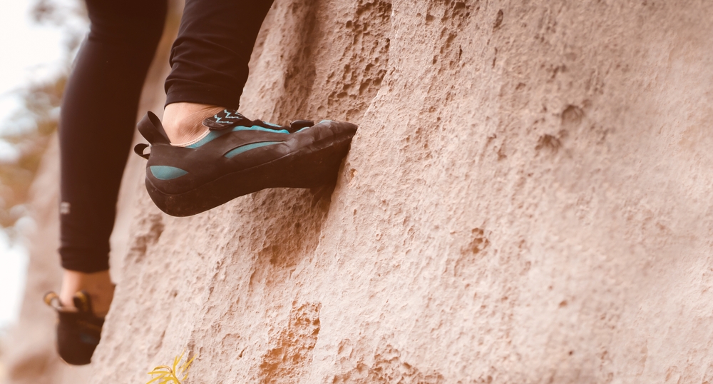 A person climbs the mountain