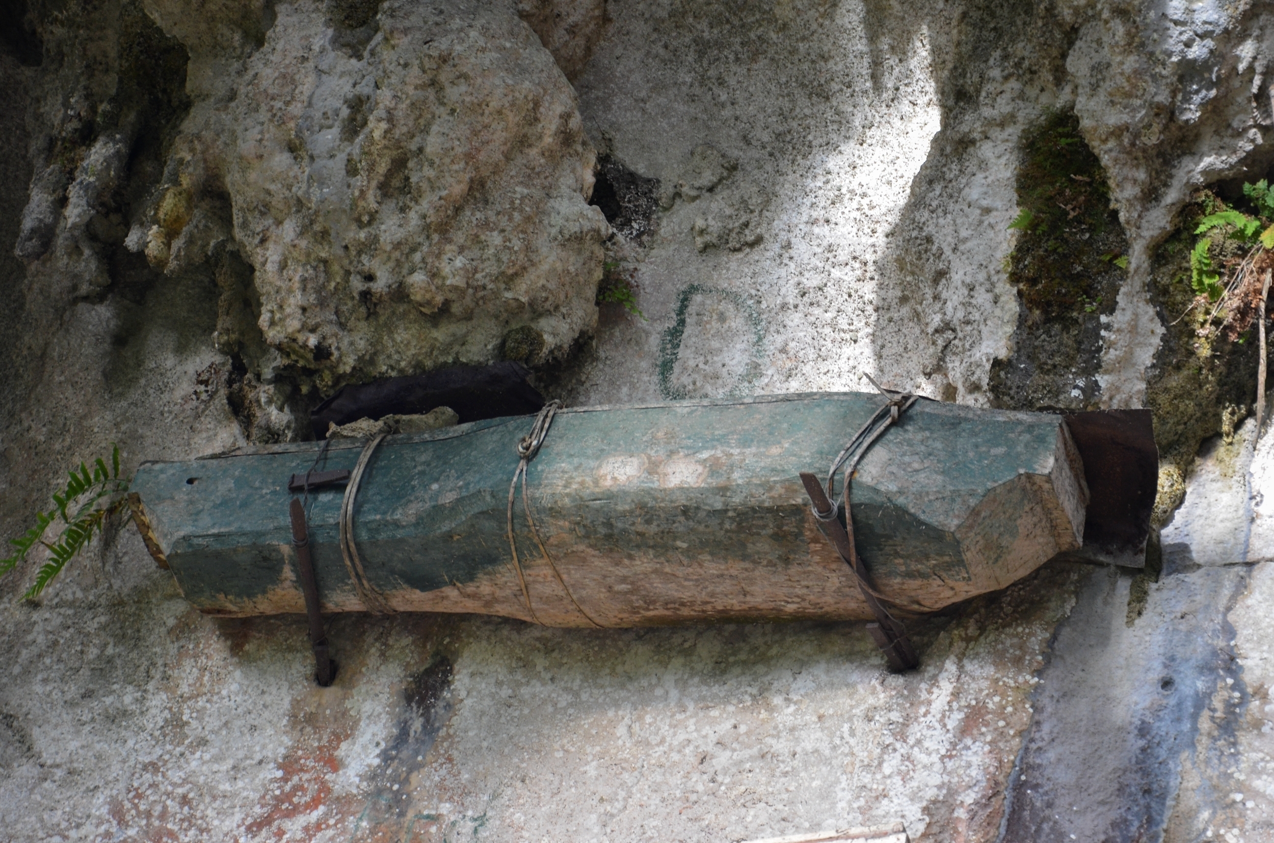 standing coffin on a cliff