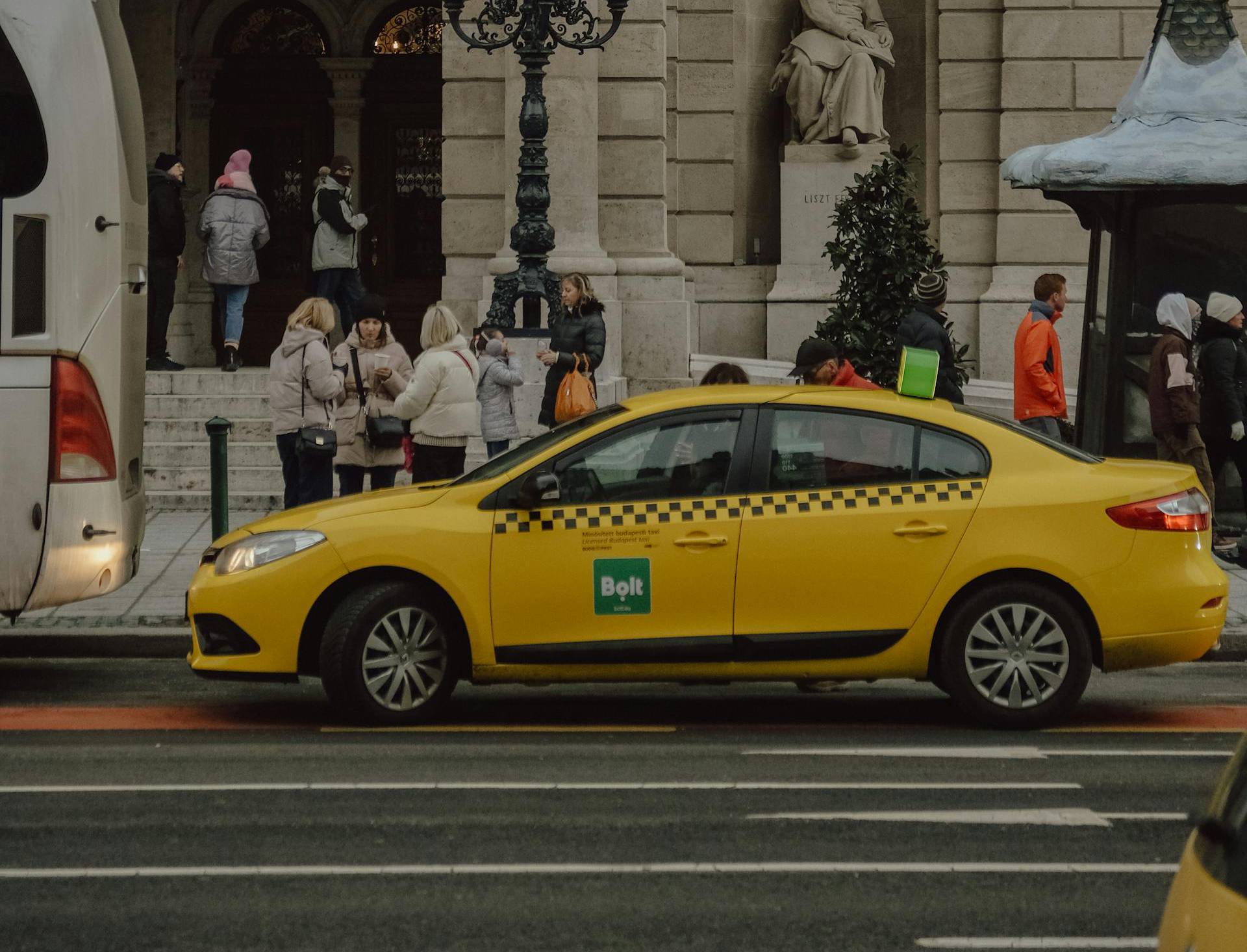Tourists waiting  for a  Yellow Taxi
