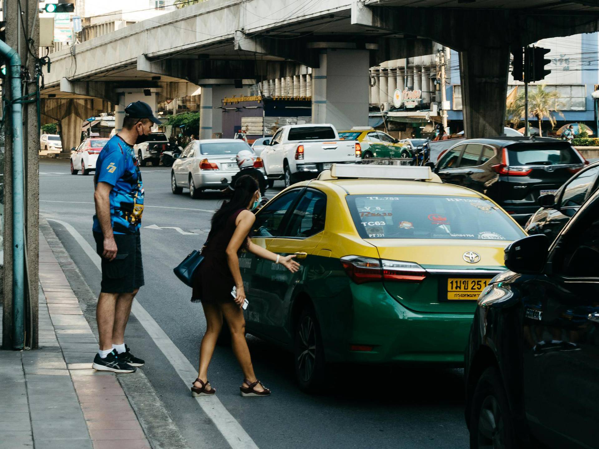 woman opening a taxi door
