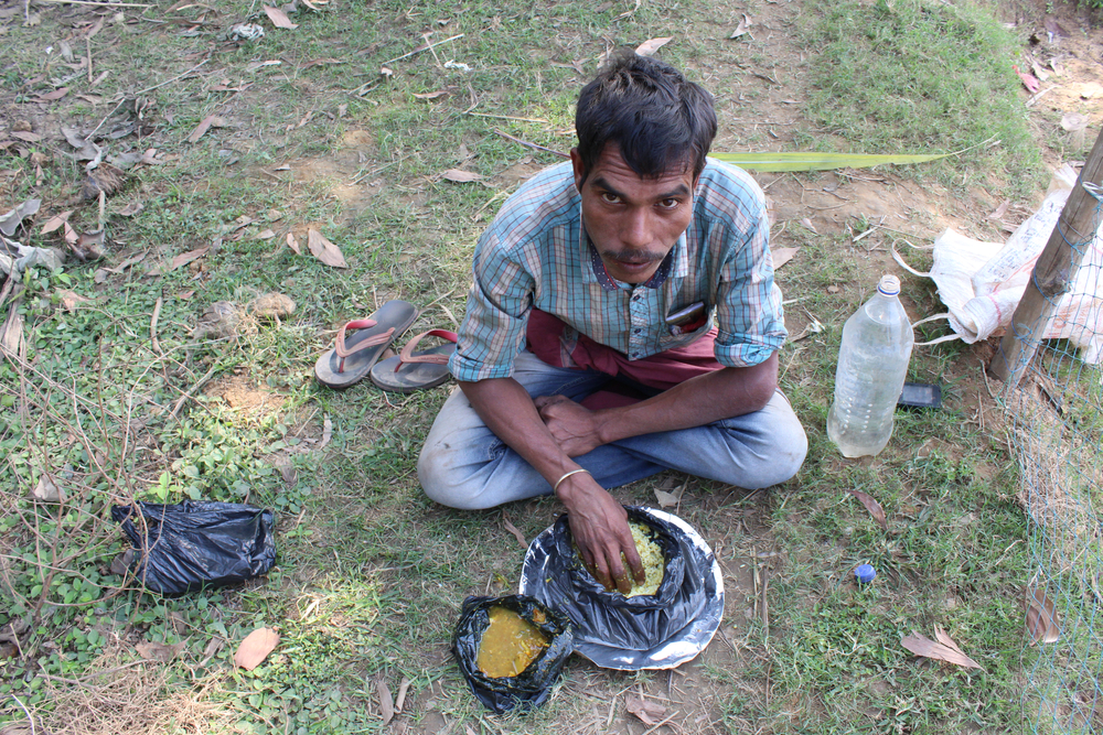 Indian man eating rice