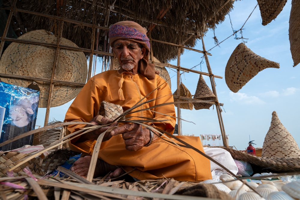 Man in India making baskets
