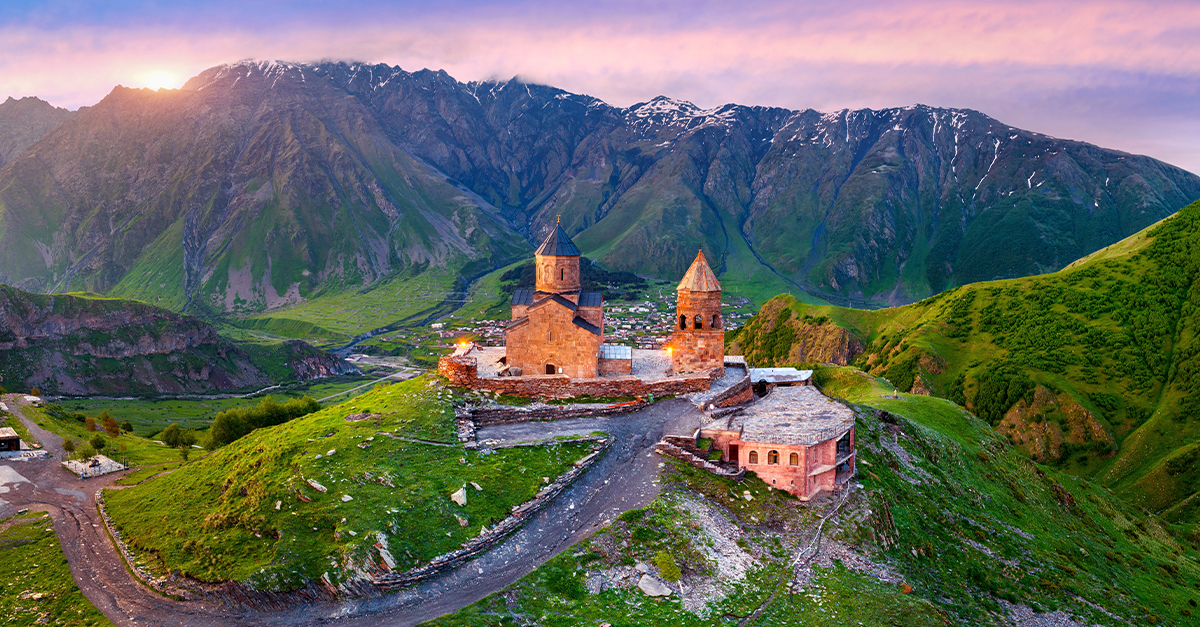 Aerial view of Gergeti trinity church at sunrise in Georgia.