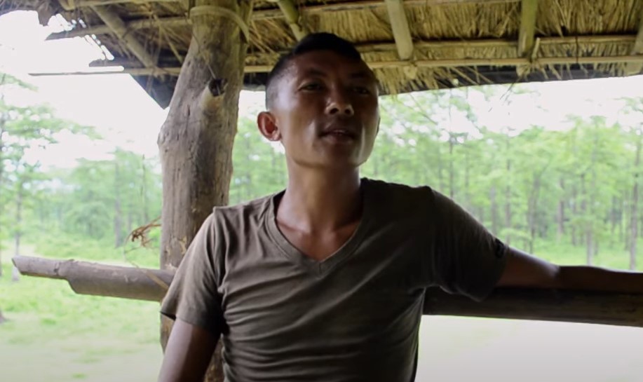 Toto people, Toto man sitting in hut