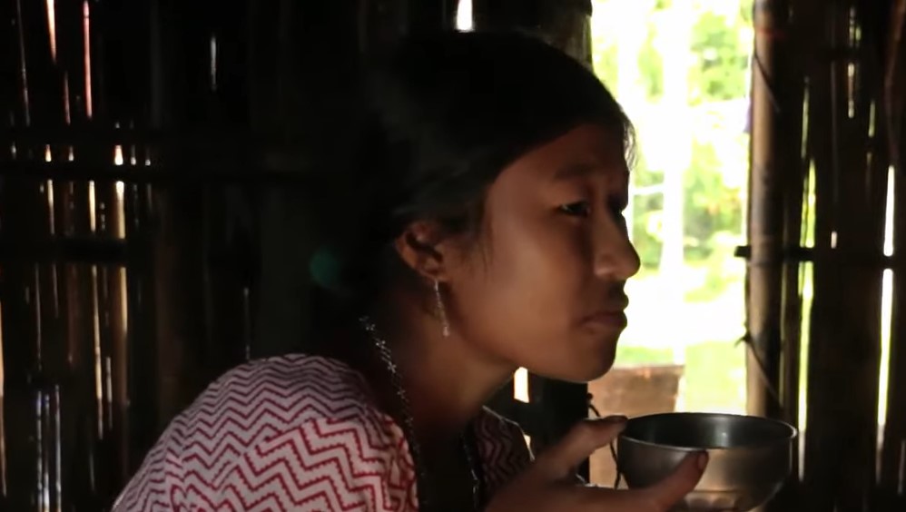 Toto people, Toto woman offering food 