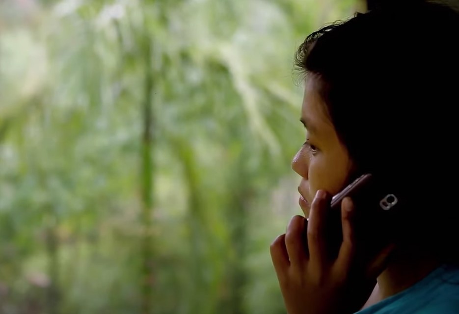  Toto woman speaking on cell phone 