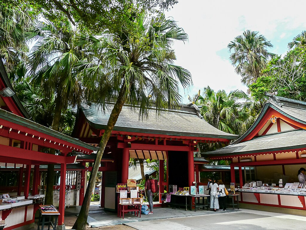 Photo of the Aoshima Island Shinmon Gate surounded with palm trees