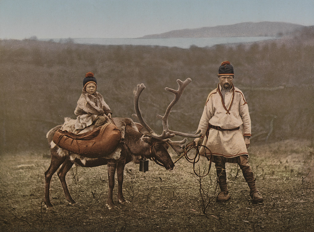 A Sami man and child in traditional clothes