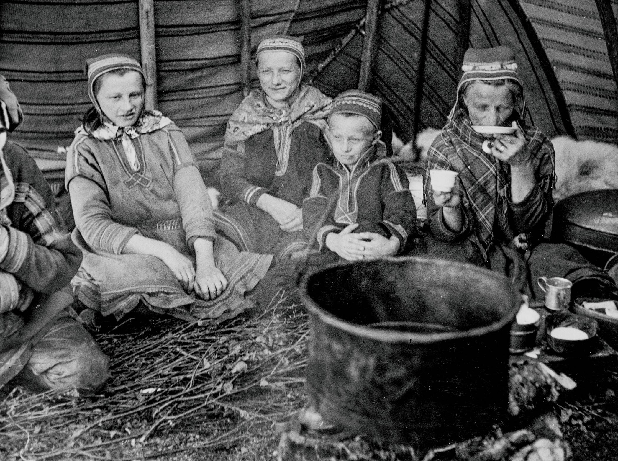 People In A Sami Hut