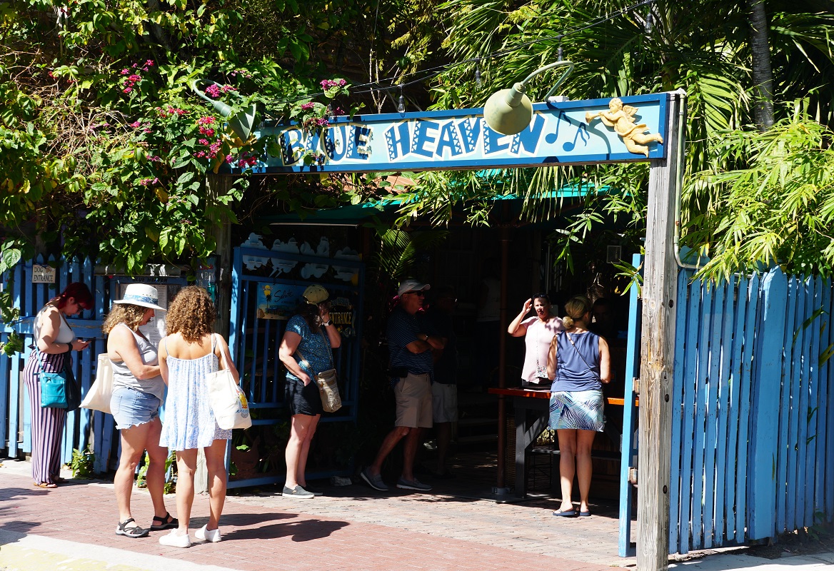 Key West, Florida, U.S.A - February 22, 2022 - Visitors waiting in line to get into Blue Heaven restaurant