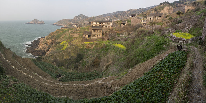 Panorama photo of houses covered with plants in Houtouwan China