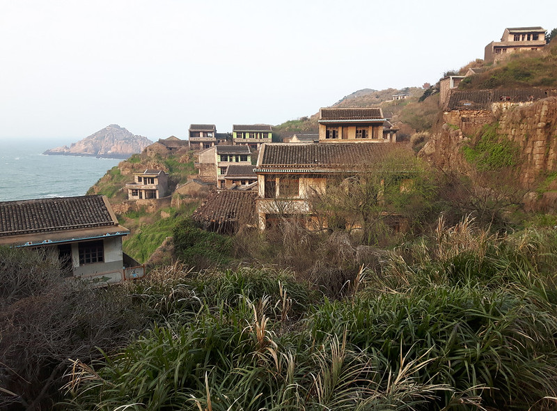 Landscape photo of houses covered with plants in Houtouwan China