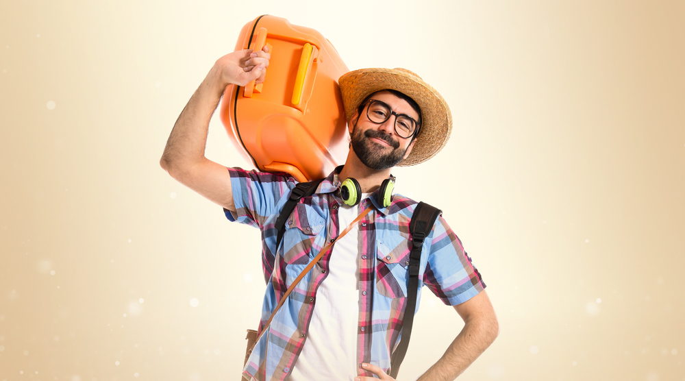 Happy tourist over ocher background