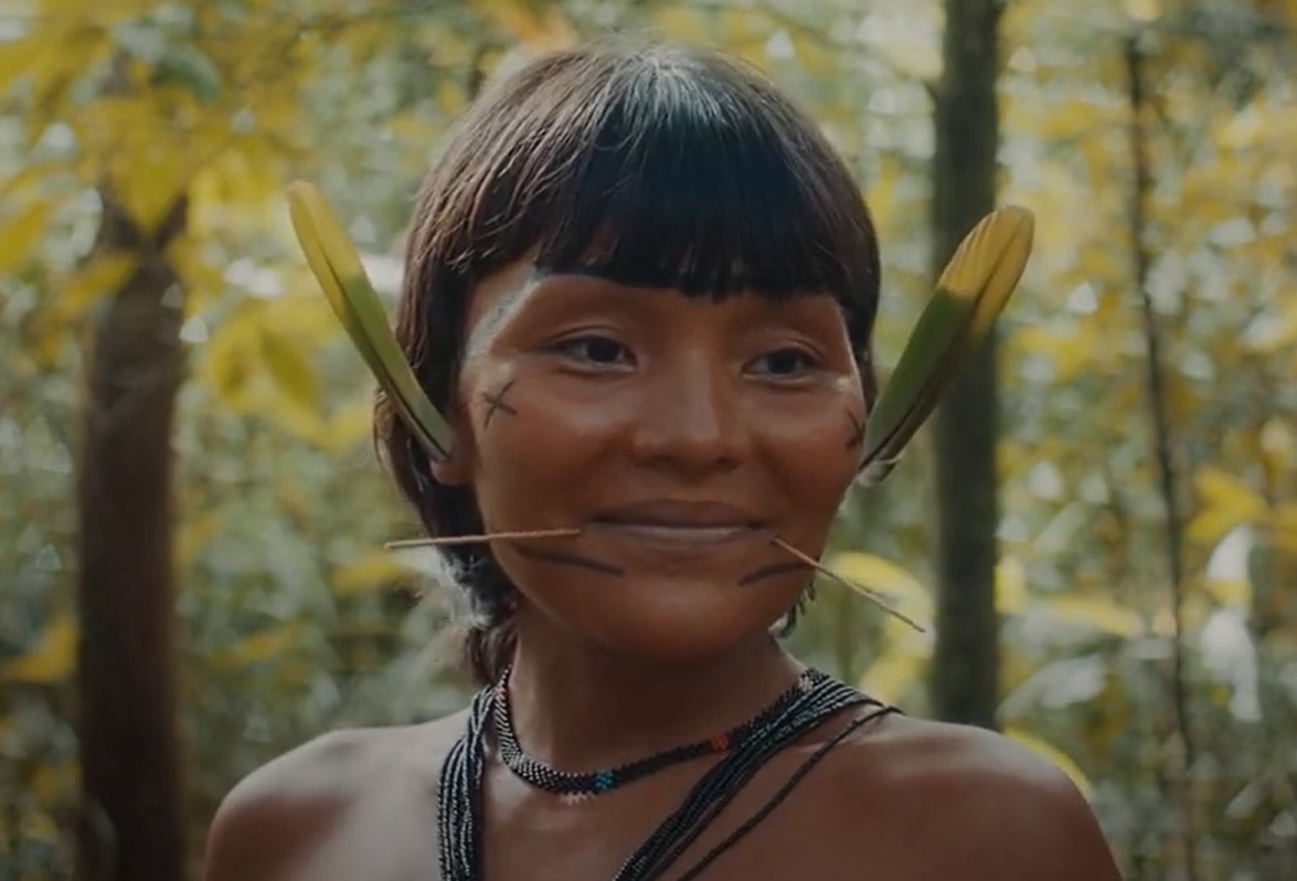 Portrait Photo of Yanomami woman with traditional face decoration smiling