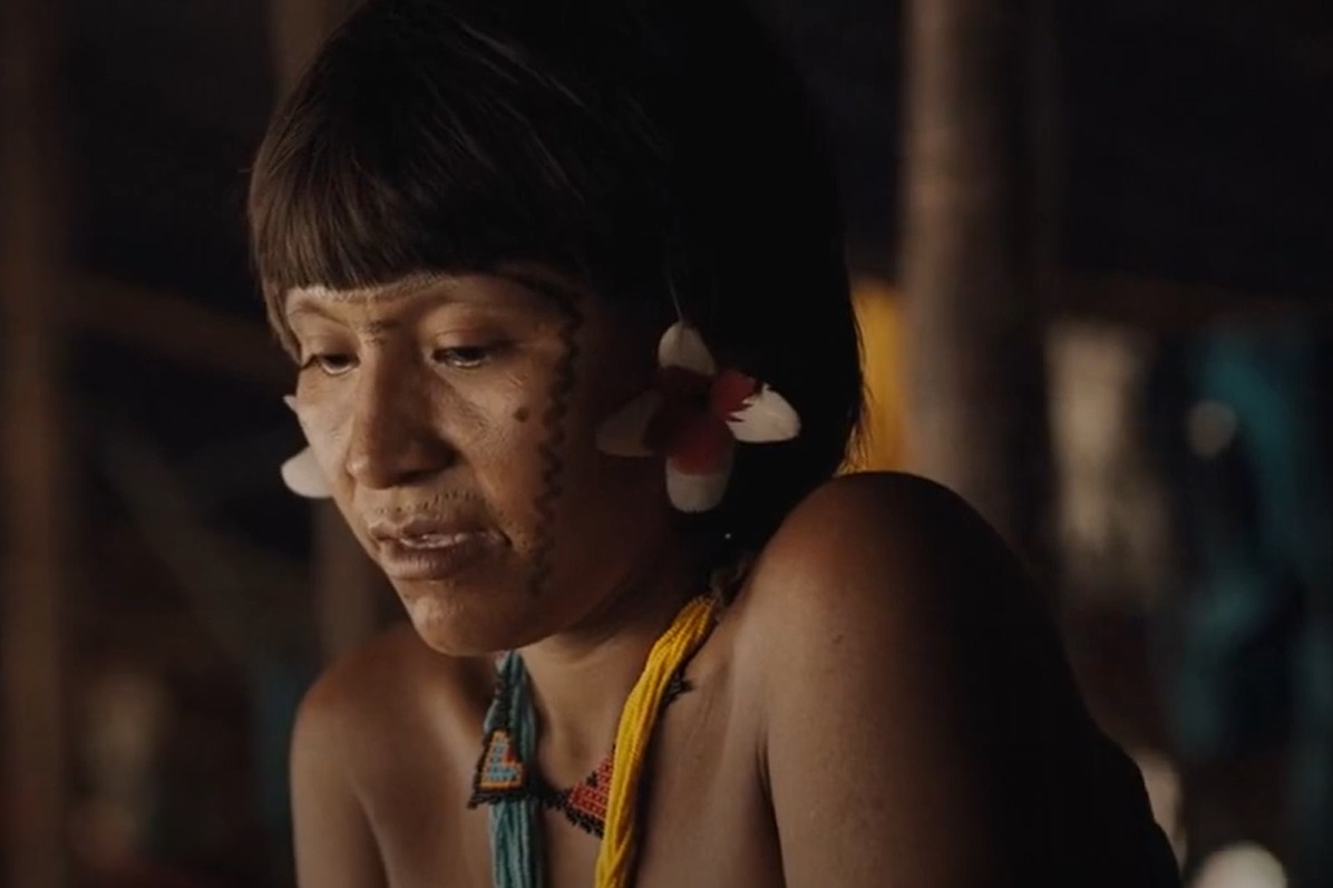 Portrait photo of Yanomami woman with traditionally painted face