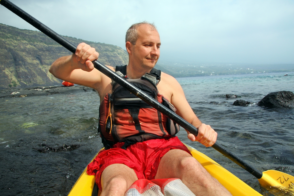 Mature man kayaking