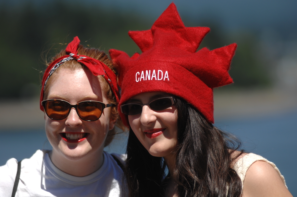 Two women standing next to each other and smiling