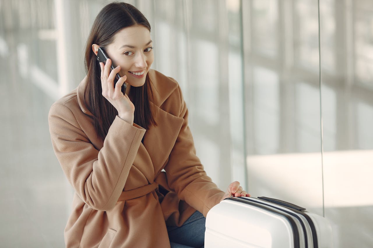 woman talking on smartphone in airport