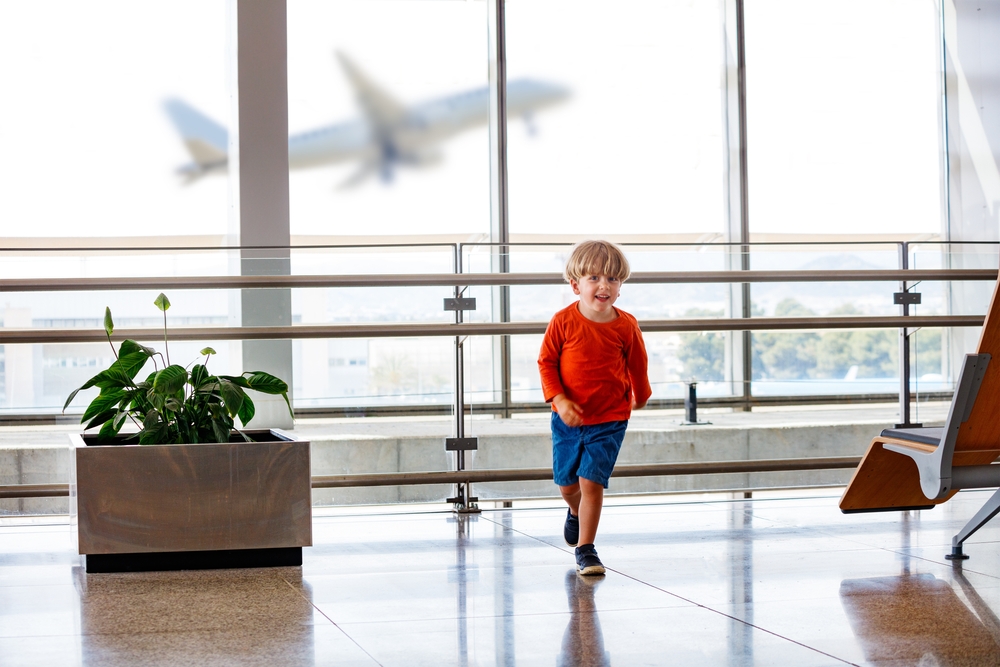 Little boy run in airport lounge