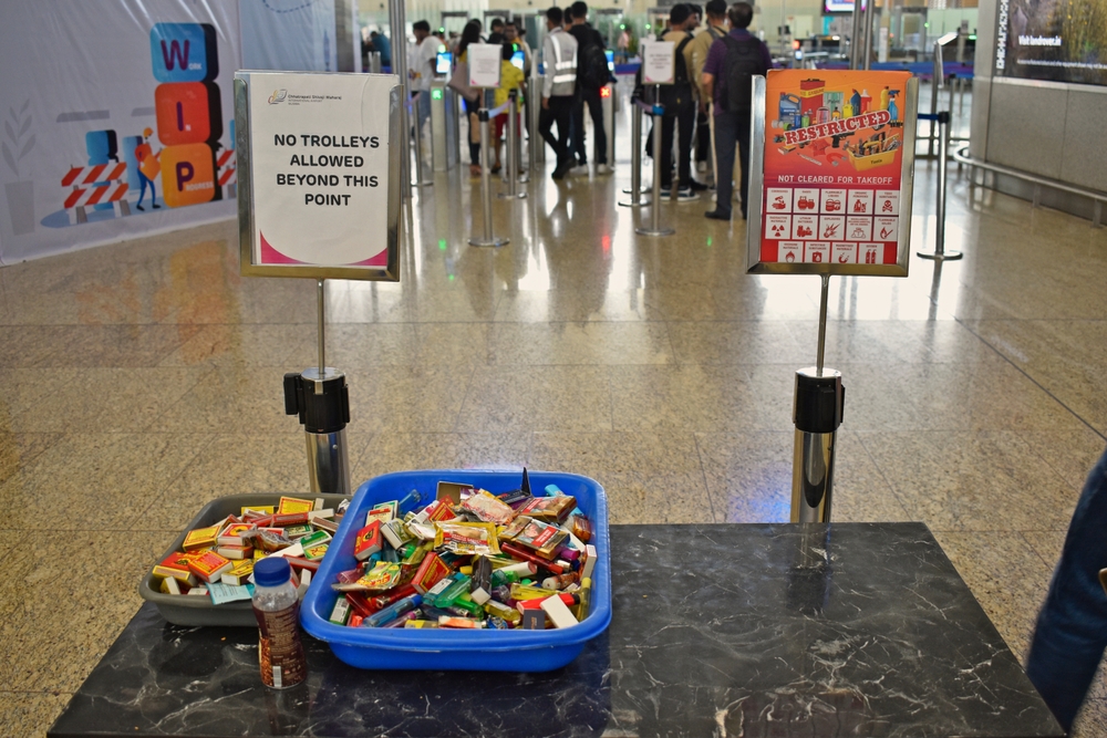 Airport security check before flight with can for prohibited items