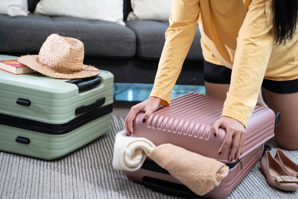woman packing hand luggage
