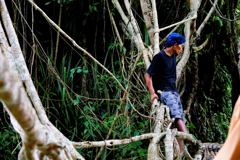Man wearing blue headband form outer village