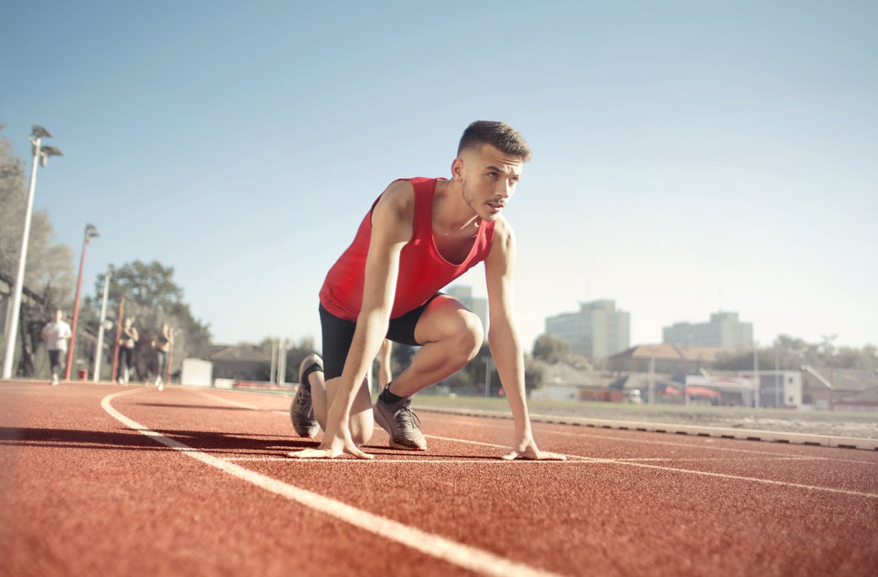 Man Running On Athletic Field