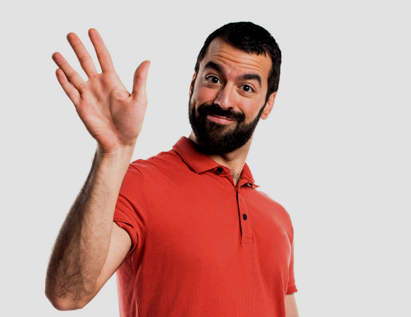Man wearing red polo shirt is waving on white background.