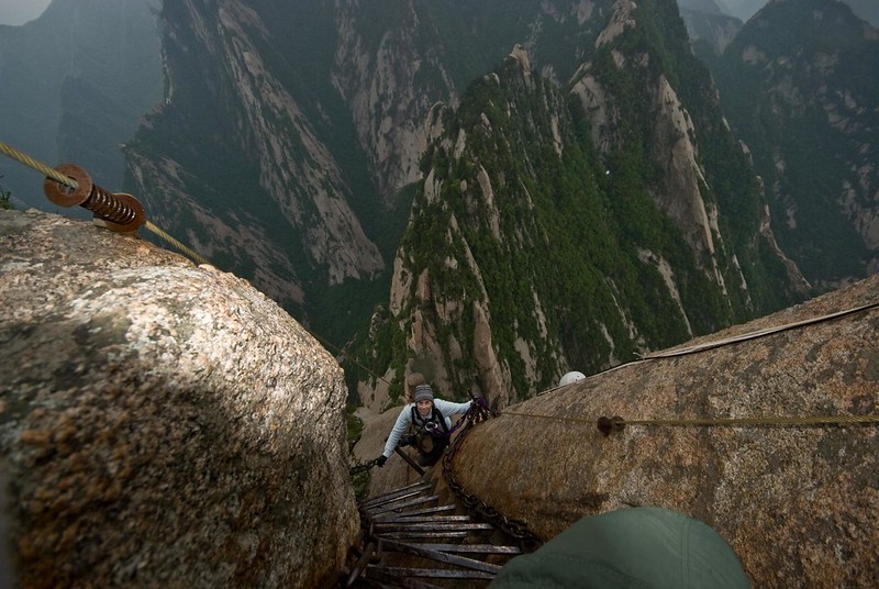 people climbing on Mount Huashan