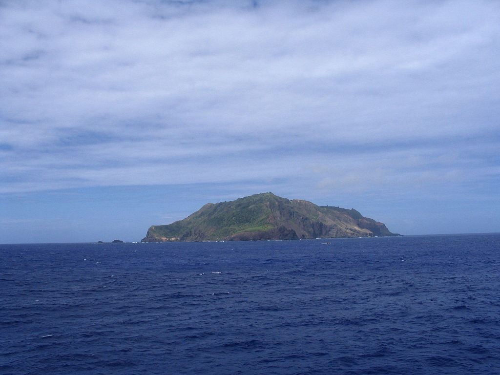 Landscape Photo of the Pitcairn Island. Cloudy Sky in the Background.