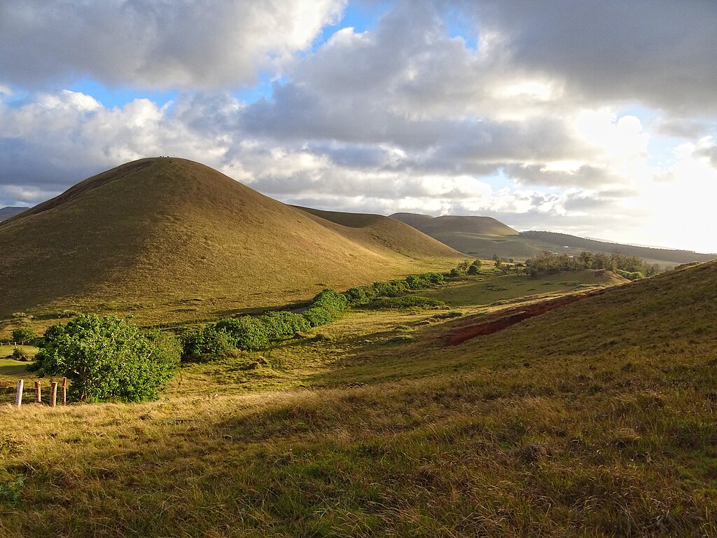 Typical landscape on Easter Island; rounded extinct volcanoes covered in vegetation.