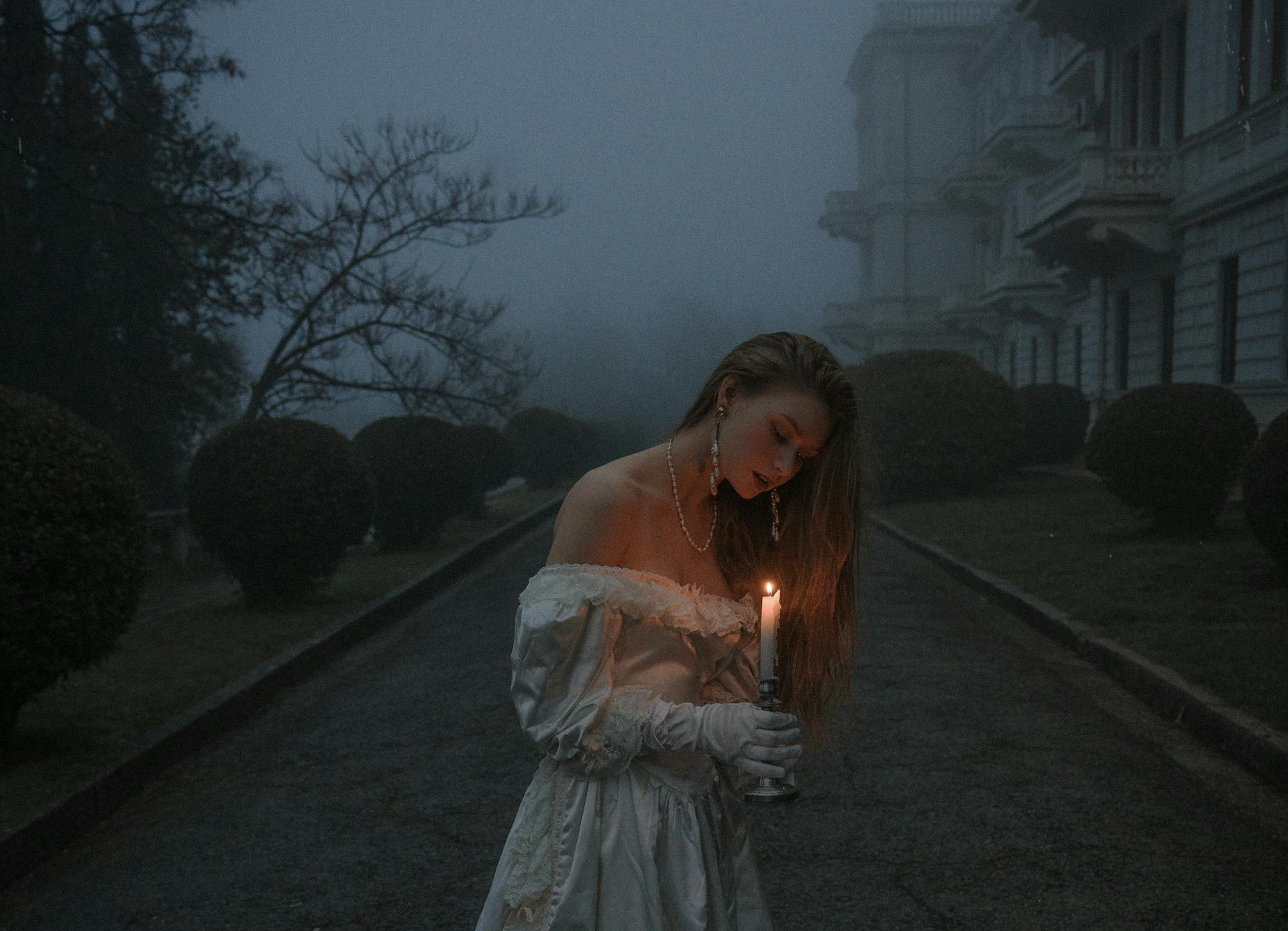 woman outside a castle