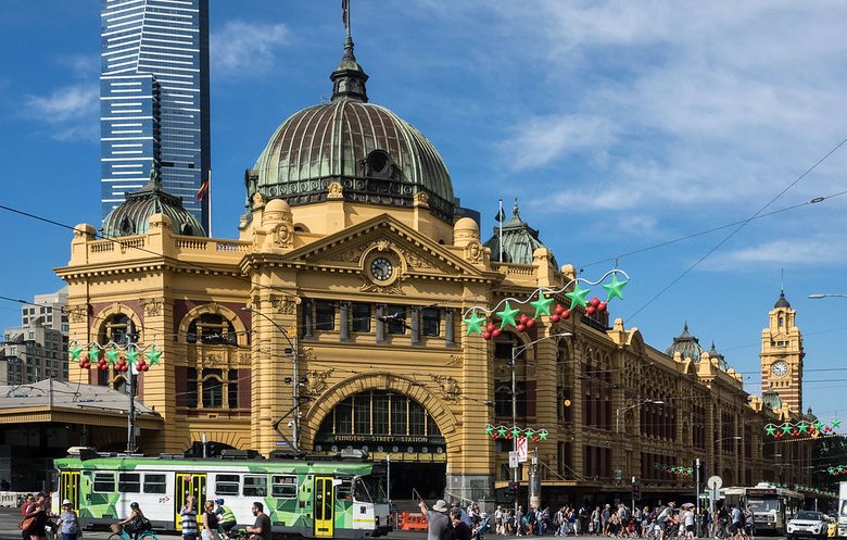 Photo of people walking on Flinders Street Station in Melbourne, Australia.