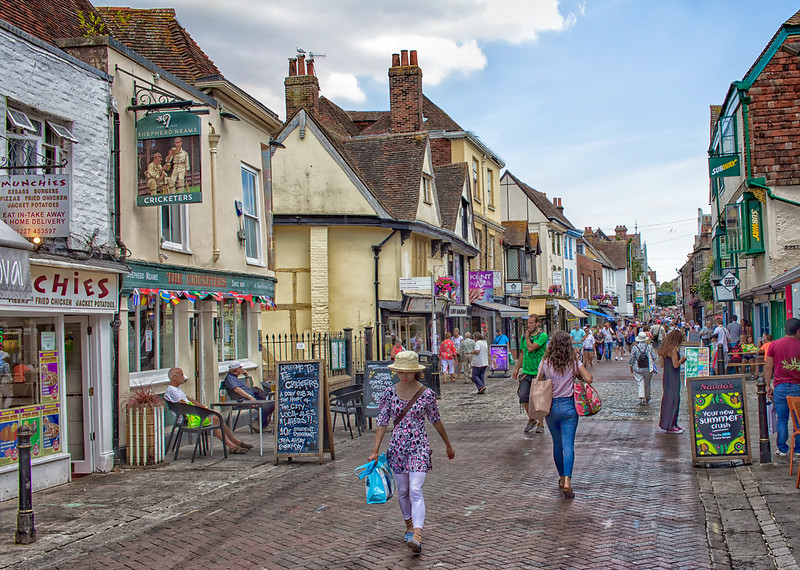 Photo of people walking on High Street, Canterbury, England.