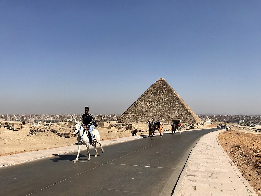 A Horse And Rider Touring The Pyramids Of Giza, In Cairo Egypt