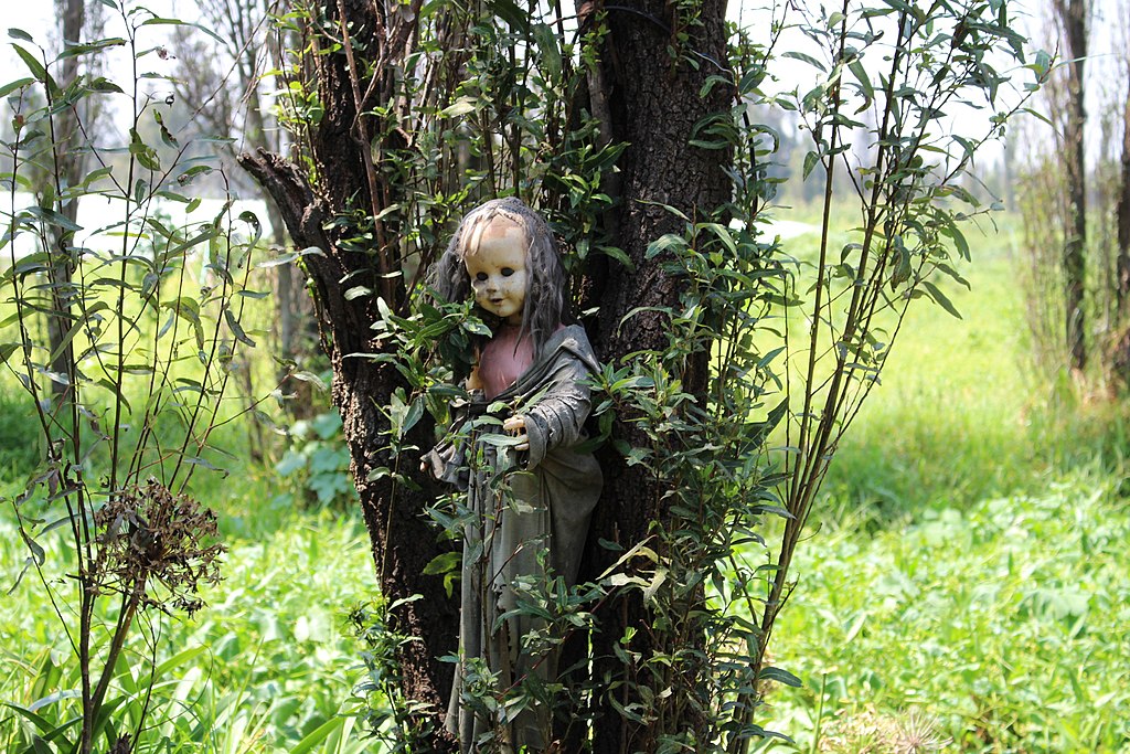 Photo of Creepy old doll in the abandoned Island of the Dolls, Xochimilco, Mexico