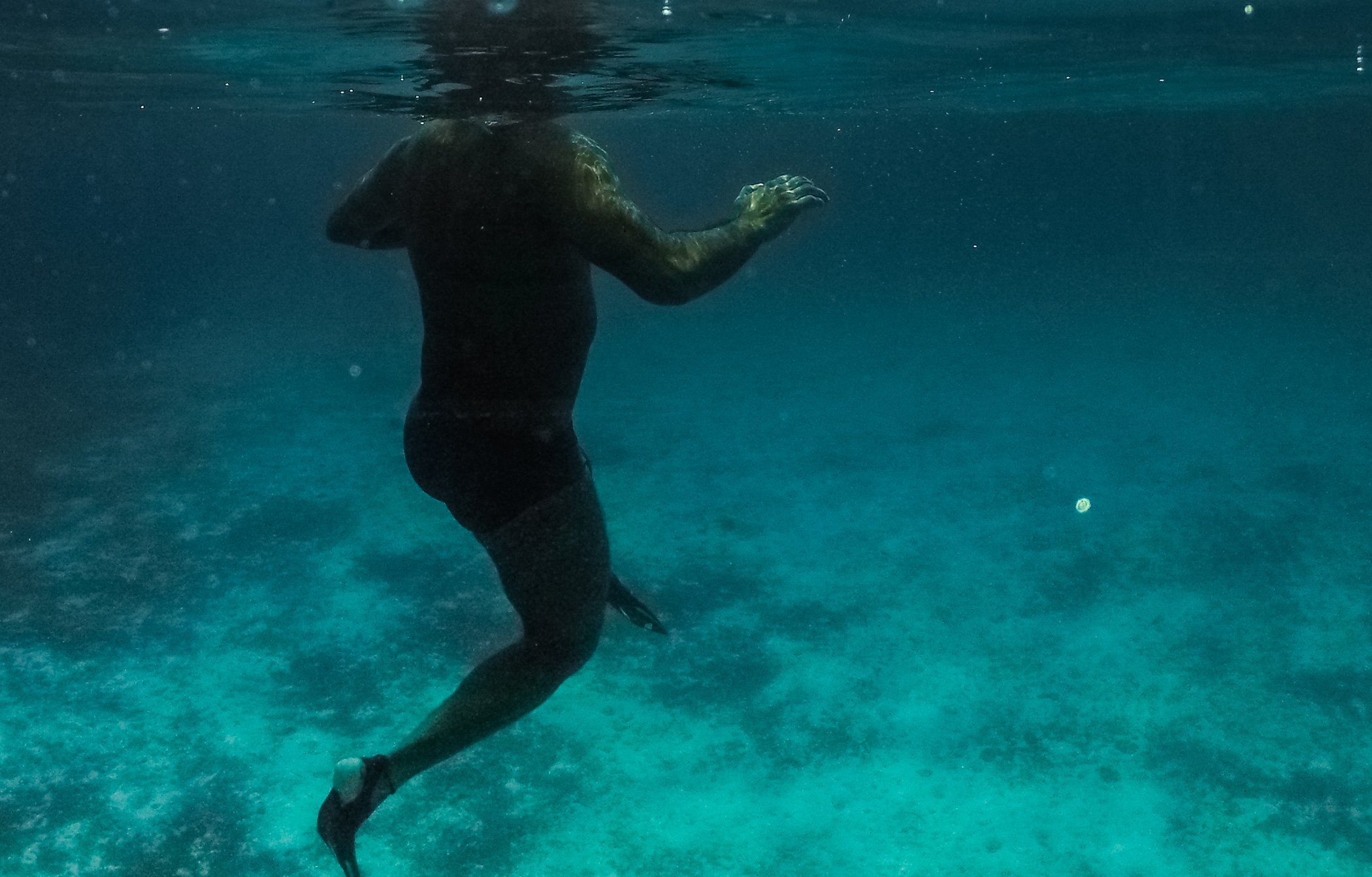 man swimming underwater