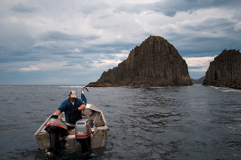 Close Up Photo of Abalone diver in a boat.