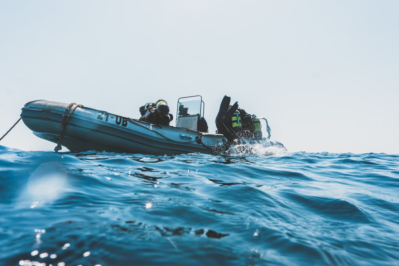 Close Up Photo of Photo Of Scuba Divers On Boat.