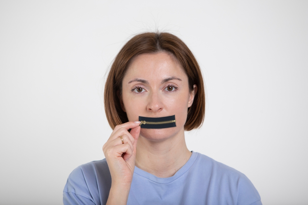 The woman remains silent