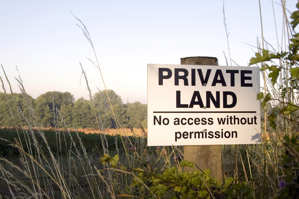 Private land sign on farmland