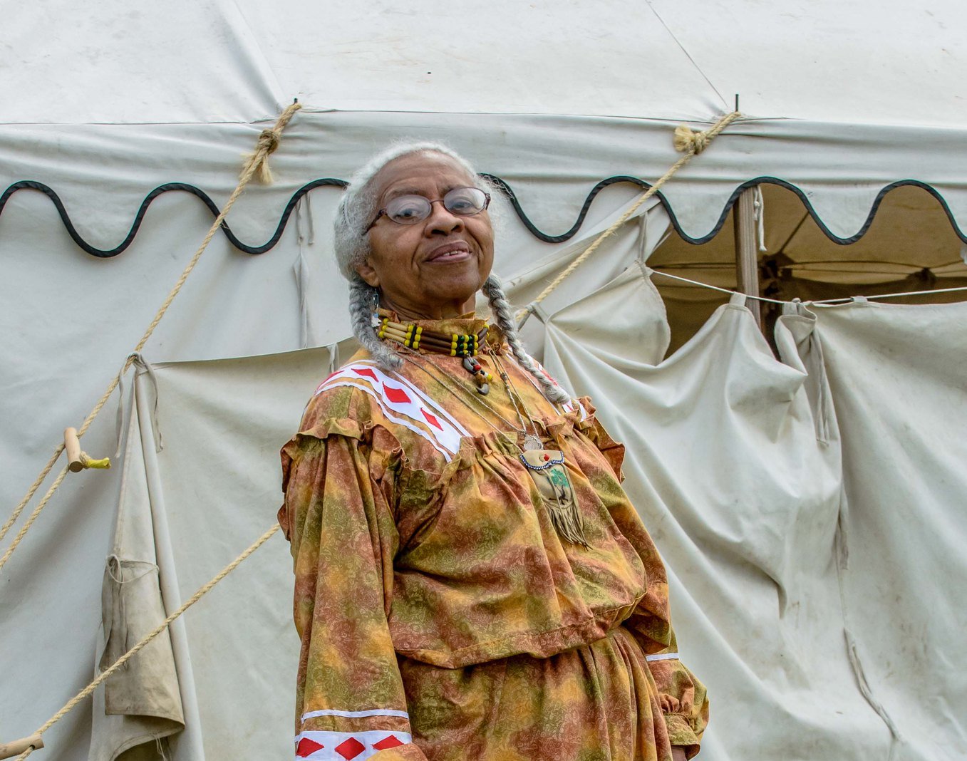 Portrait Photo of Native American woman in traditional clothing