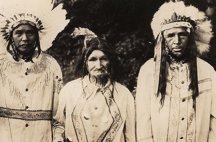 Real photo view of three Native Americans, two men and one woman