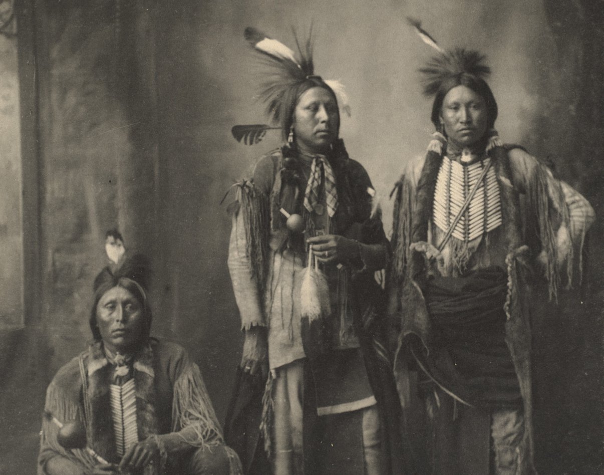 Grayscale Portrait Photo of Native American men in traditional clothing