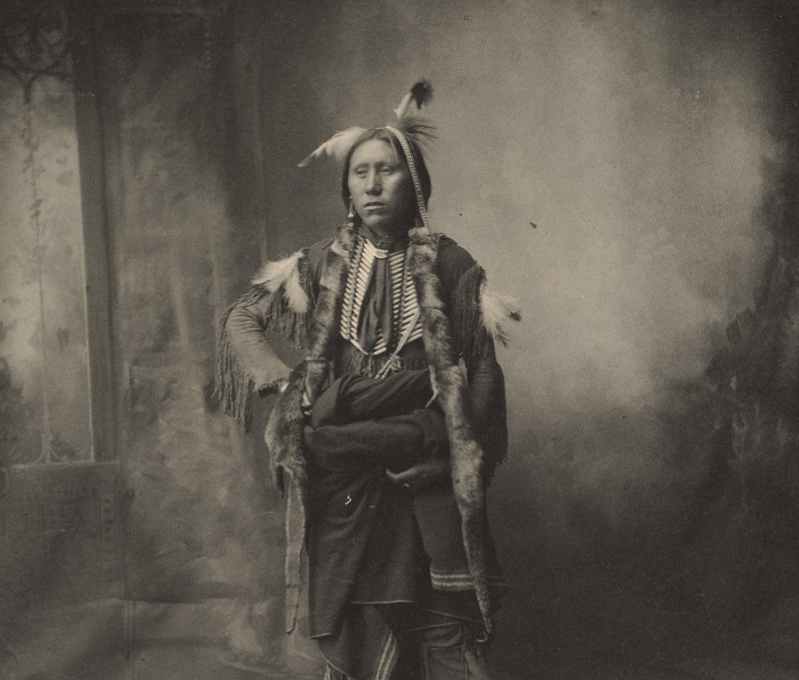 Grayscale Portrait Photo of Native American woman in traditional clothin