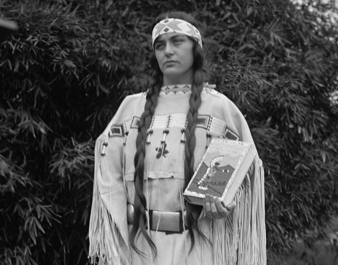 Ruth Muskrat Bronson, a Cherokee Indian, holds a copy of The Red Man in the United States